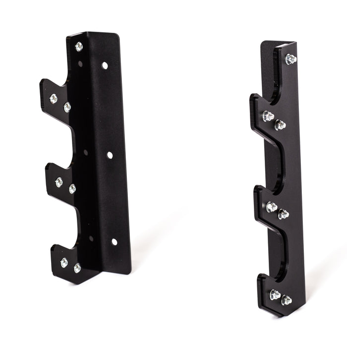 The Bells of Steel 3 Barbell Wall Rack includes two black metal brackets with multiple notched hooks and screws for secure, wall-mounted barbell storage, shown upright against a white background.
