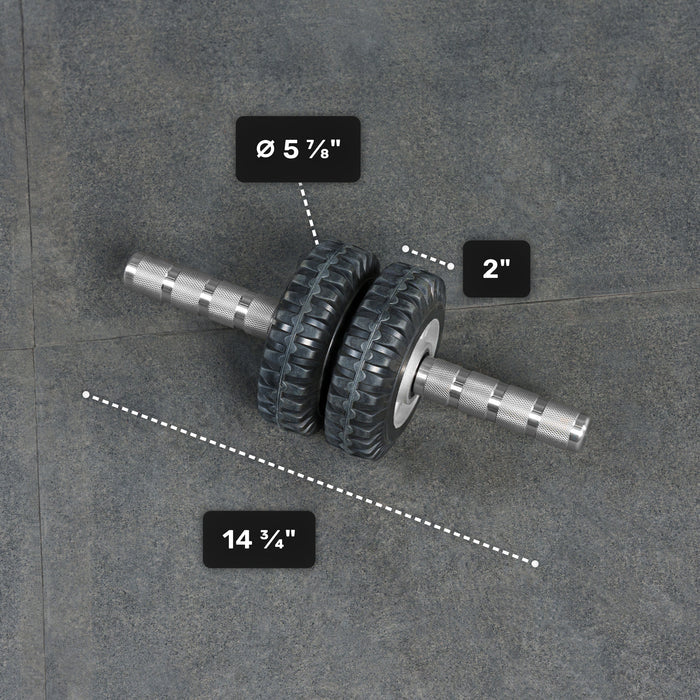 The ABsyidyan Stainless Steel Ab Roller by Bells of Steel USA features extra-wide dual wheels (5 5/8" diameter, 2" width), a 14 3/4" handle, supports up to 500 lbs, and is shown on a gray surface.