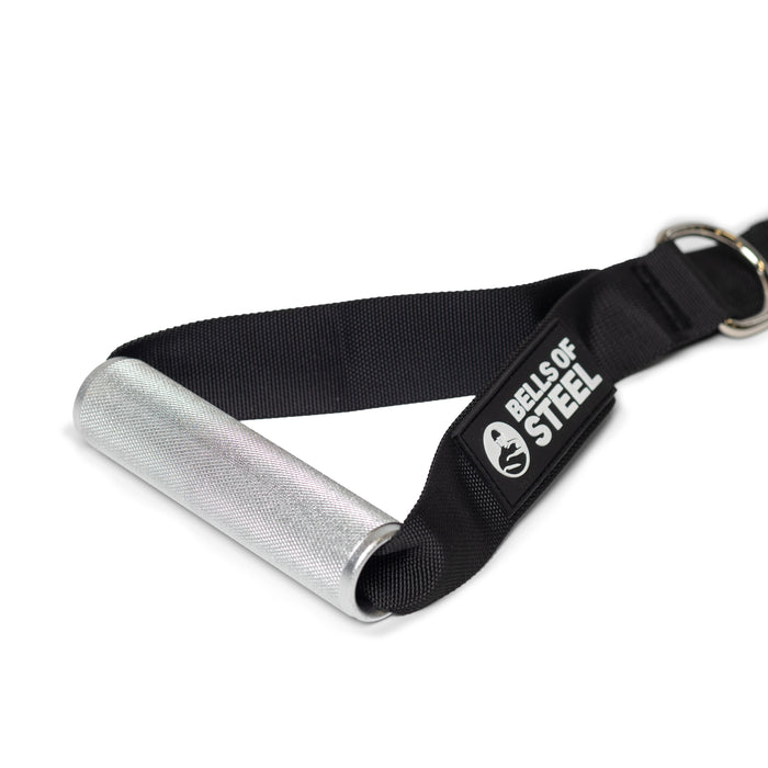 A close-up of Bells of Steel Adjustable Length Aluminum Handles attached to a black nylon strap with the logo. The textured grip and metal D-ring make these ideal gym accessories for cable machine workouts.
