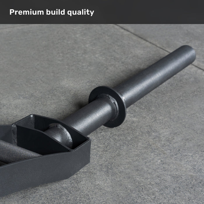 A close-up of the Bells of Steel Arch Nemesis Swiss Bar, a black specialty barbell, rests on a gray stone floor with "Premium build quality" displayed at the top left corner.