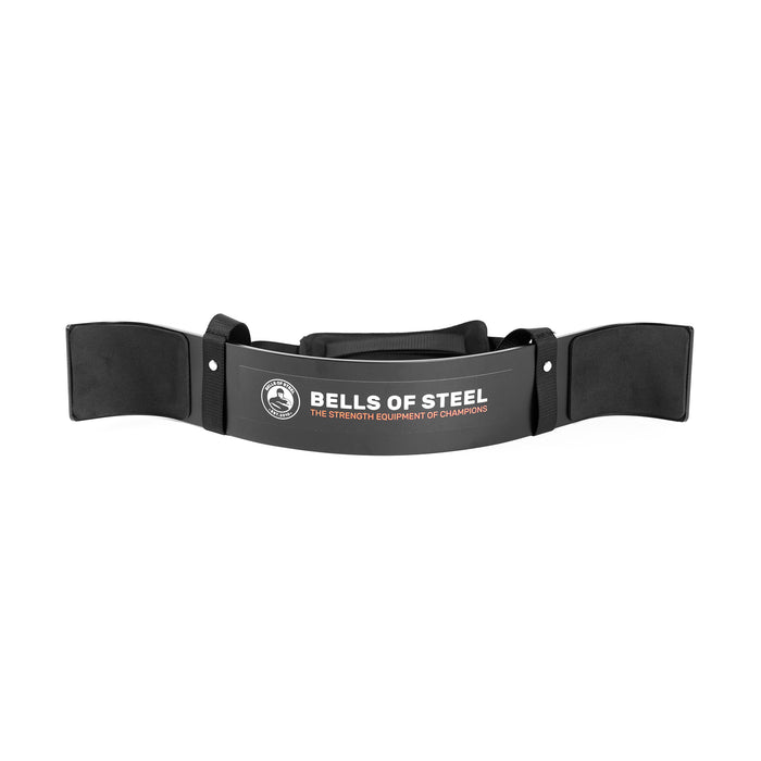 The Bells of Steel Arm Blaster is a black, padded arm support with a neck strap and the brand’s logo—ideal for isolating biceps during curls or providing extra support for tricep pushdowns.