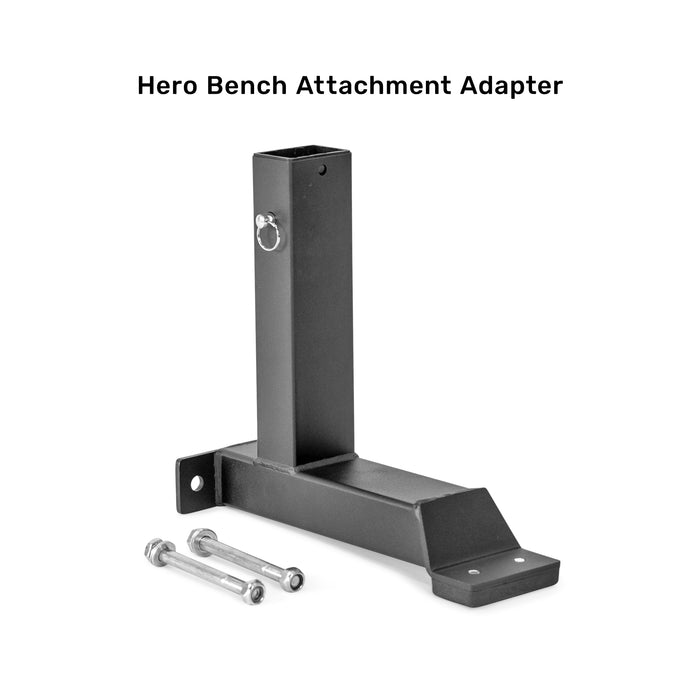 A black Bells of Steel Bench Attachments adapter, compatible with Buzzsaw and other benches, shown with two bolts and nuts on a white background. “Hero Bench Attachment Adapter” text appears above.