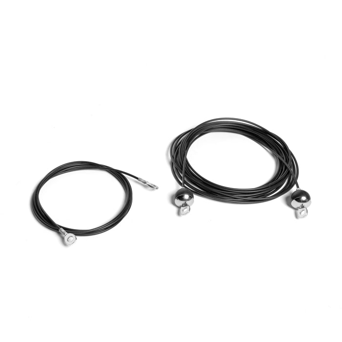 Two black Bells of Steel USA replacement cables for the Plate-Loaded Cable Tower rest on a white surface. The thicker, larger coil on the right has two silver ball ends, while the smaller coil on the left has one silver ball end.
