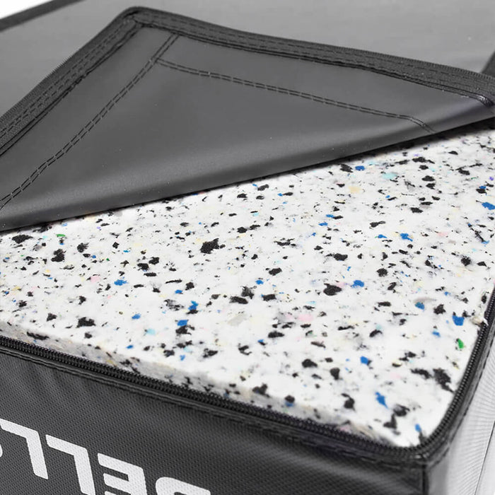A close-up of Bells of Steel Deadlift Pads (Pair) shows the black cover unzipped to reveal speckled foam—designed to reduce noise during weightlifting.