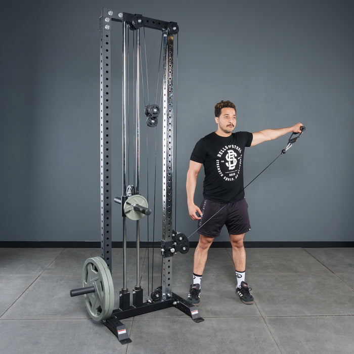 A man in a black t-shirt and shorts uses the Bells of Steel Fat Bar - Single D Handle on a cable machine, performing a lateral raise in the gym to improve grip strength.