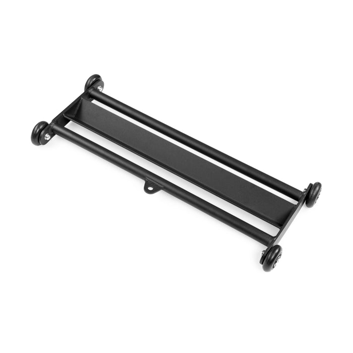 The Bells of Steel Glute Ham Slider features a black metal rectangular frame with four corner wheels, making it a mobile base ideal for supporting and moving equipment or performing hamstring and ab exercises.