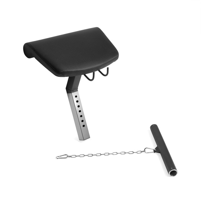 The Bells of Steel USA Legacy Leg Extension / Hamstring Curl Machine is a black, plate-loaded home gym attachment with a padded top, adjustable metal support arm, and chain-linked bar for versatile leg workouts.
