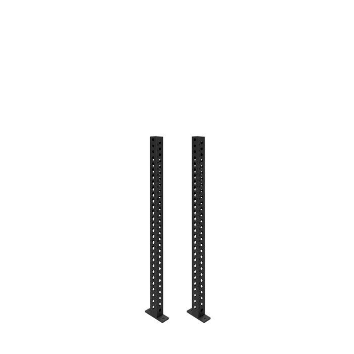 Two black metal Manticore Vertical Uprights by Bells of Steel, each 3x3 with multiple evenly spaced holes, stand parallel on flat bases against a plain white background—ideal for expanding your power rack with compatible attachments.