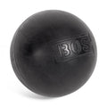 A black Bells of Steel massage ball featuring textured "BOS" lettering rests elegantly on a white background. This versatile tool enhances muscle massage, offers targeted relief, and improves flexibility.