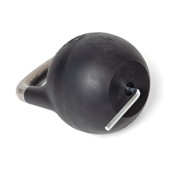 A plastic-bottom adjustable kettlebell by Bells of Steel lies horizontally, with a metallic handle and an Allen wrench in a side hole for weight increments. Its smooth black surface is marked, making it suitable for single-arm exercises.