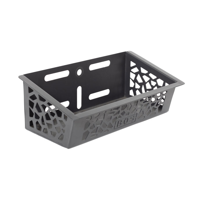 The Bells of Steel Rack Attached Storage Basket is a black plastic basket with geometric cut-outs and mounting holes, ideal for efficient gym storage or organizing your fitness accessories.