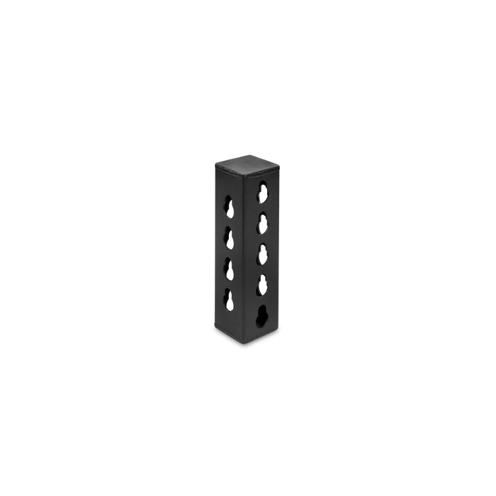 The Bells of Steel USA Rack Junctions - 3" x 3" is a black, rectangular metal block with multiple circular holes, ideal for rack setup or junctions, shown standing upright on a white background.