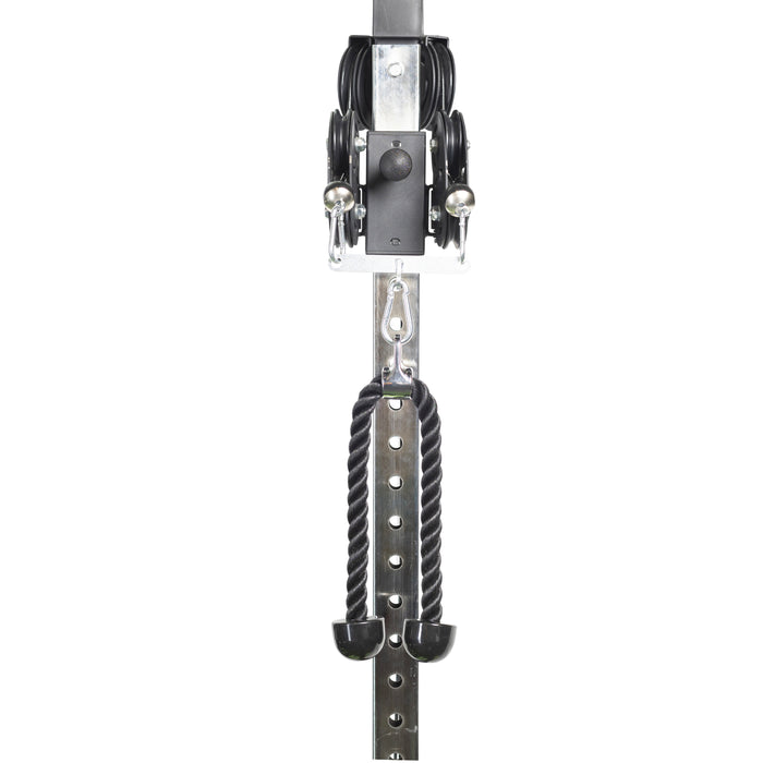 The Bells of Steel Tricep Rope Extension, a black cable machine attachment, hangs from a metal adjustable pulley system for gym or strength training exercises against a white background.
