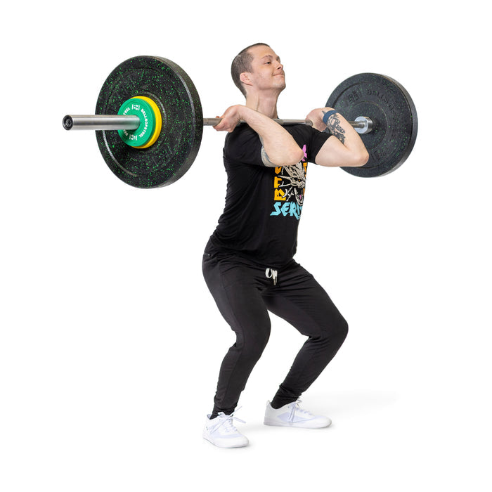 A person in black athletic wear and white shoes performs a front squat with a loaded barbell featuring Bells of Steel Urethane-Coated Change Plates, set against a plain white background.