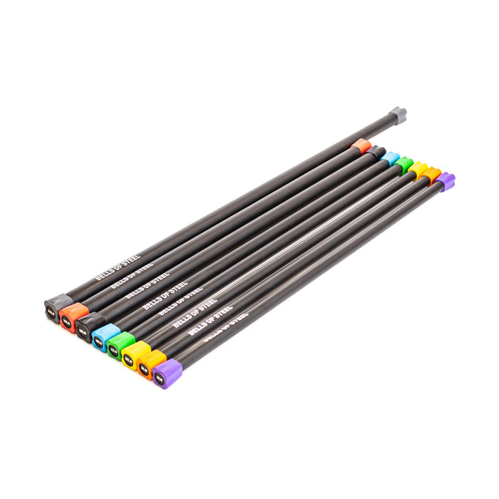 A set of eight Bells of Steel Weighted Workout Body Bars, each with a different colored tip, is aligned like sleek fitness gear. The bars are labeled with white text along their sides, resting on a white surface.