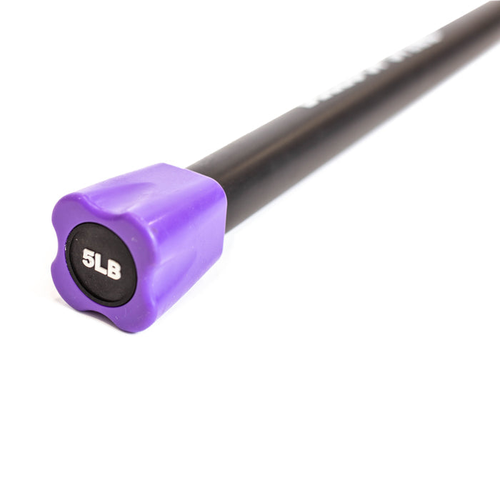 A Bells of Steel Weighted Workout Body Bar, featuring a black body with a purple end cap labeled "5LB," rests on a white surface, showcasing essential strength training gear.